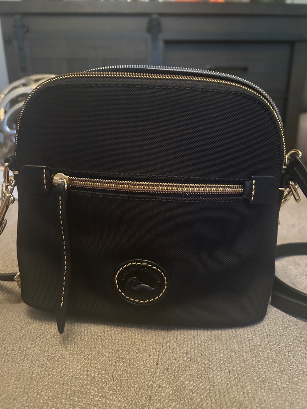 Dooney & Bourke Black Domed Crossbody with Gold Hardware and Contrast Stitching